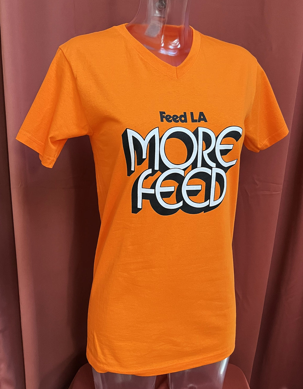 "Feed LA More Feed" T-Shirt, b/w print on orange